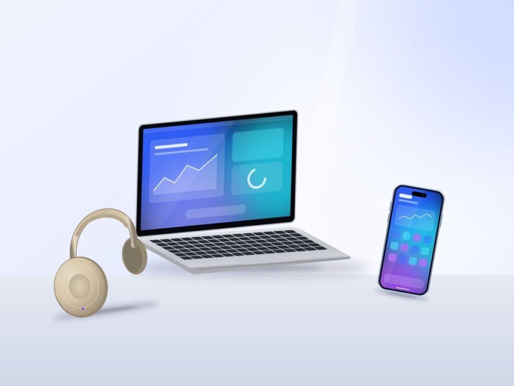 Laptop, smartphone and headphones on a desk